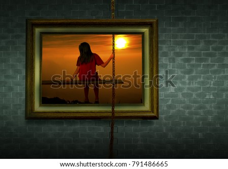 alone lonely concept : girl in picture frame on the wall