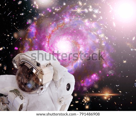 Astronaut in space. Lights, stars and galaxies.The elements of this image furnished by NASA.