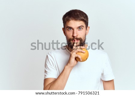man with orange on a light background                               