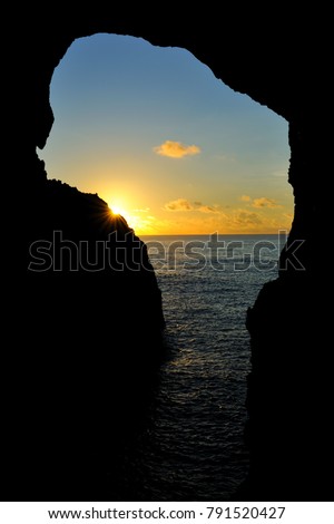 Taiwan, Taitung, Orchid Island, from the rock hole to see the clear coastline and beautiful sunset clouds.