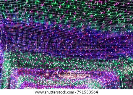 Abstract background texture or wallpaper of cave of seamless numerous colorful bright lights with spreading nets in perspective view