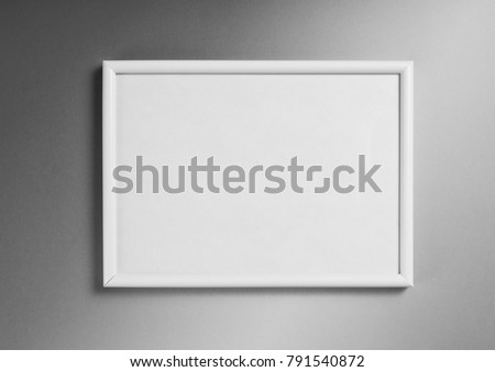 White frame for paintings or photographs on gray background