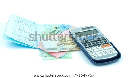 Baht 20, Baht fifty,one hundred baht,one thousand Baht at the top of the passbook and calculatoron white background isolated,with copy space for writing text.