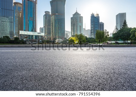 empty asphalt road front of shanghai cityscape