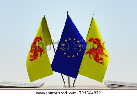 Two flags of Wallonia and European Union flag between