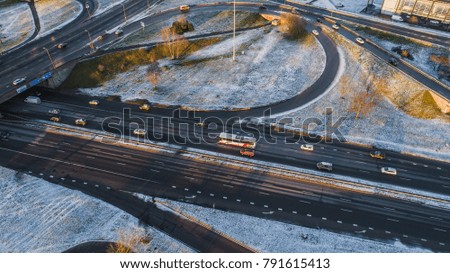 Aerial view on Riga elevated road junction and interchange overpass at winter sunset time