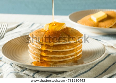 Sweet Homemade Stack of Pancakes with Butter and Syrup for Breakfast Royalty-Free Stock Photo #791630443