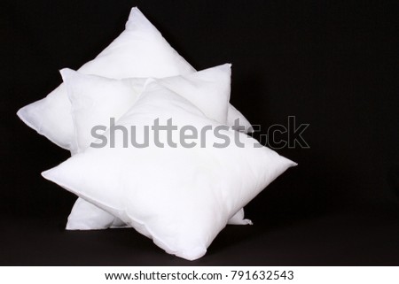 cushion pad inserts sitting on a table with black background no people stock photography stock photo
