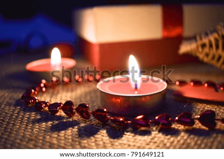 Romantic picture for demonstrating love feelings with candles and the gift