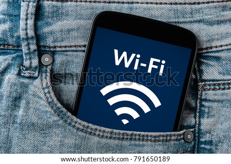 Free wifi concept on smartphone screen in jeans pocket. All screen content is designed by me. Flat lay