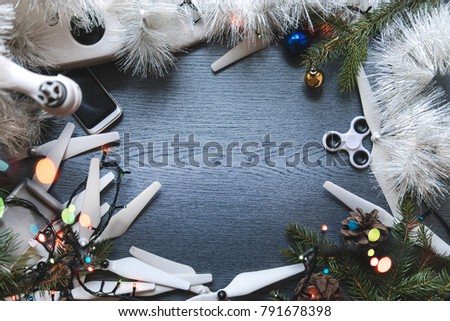 Drone equipment, control panel on the background of a dark wooden table. Aerial shooting concept. best christmas tree new year present gift. copy space