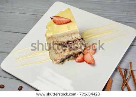 cake with white icing and strawberries