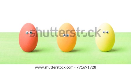 Happy Easter! Greeting card. Colorful funny eggs with eyes, isolated on white