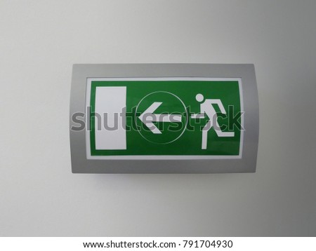 Green exit sign on wall