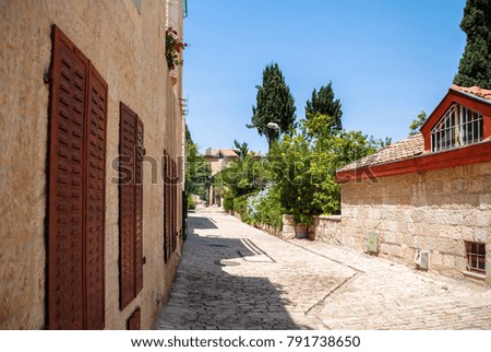 Horizontal picture of old medieval street with houses built with white bricks in Jerusalem, Israel