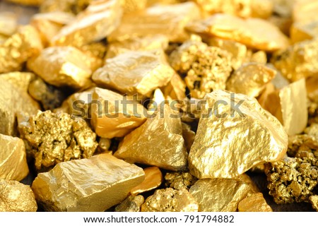 Close up lump of gold mine background texture Royalty-Free Stock Photo #791794882