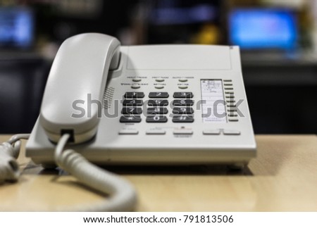 close up soft focus on office telephone device at office ,close up of the phone key pad -  business background