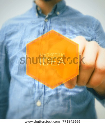 Man working on marketing idea Interface with visual orange screen.