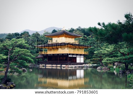The beautiful architecture of Kinkaku-ji ( or called "Golden Pavilion Temple" in English ) and the Japanese zen garden at Kyoto, Japan. Historic Monuments of Ancient Kyoto. Unesco World Heritage Site.