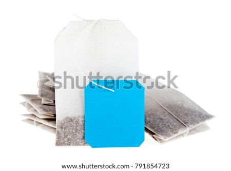 Close-up of tea bags isolated on white background. Blue label.