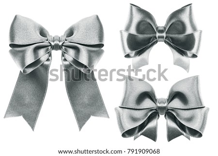 set of three silver ribbon satin bows isolated on white