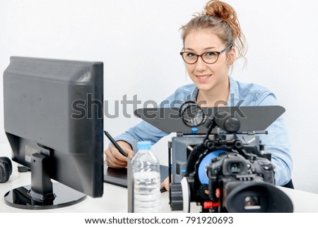 young woman designer using a graphics tablet for video editing