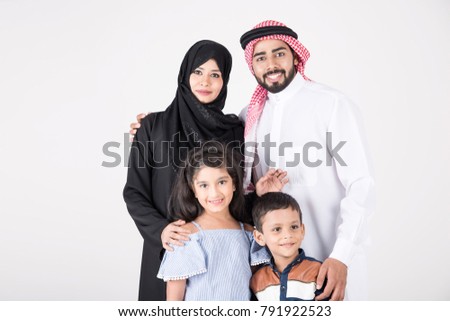 Arab family standing together and smiling on white background