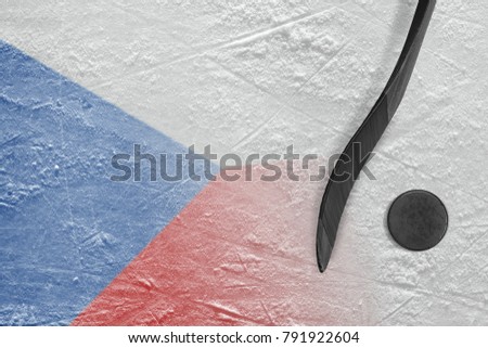 Hockey puck, stick and the image of the Czech flag on the ice. Concept, hockey