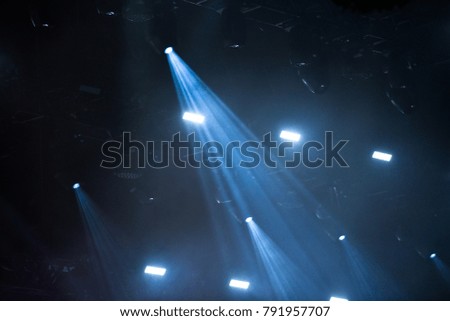 Blue stage lights during a rock concert