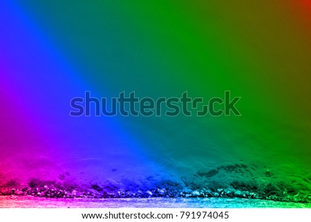 Subtropics in winter. Winter snow-covered shore in rainbow palette, marine rainbow. 