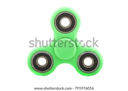 Green spinner stress relieving toy isolated on white background.