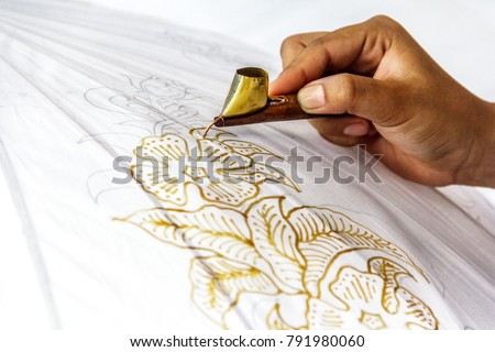 Process of making Indonesia batik with floral motif. Closeup shot Royalty-Free Stock Photo #791980060