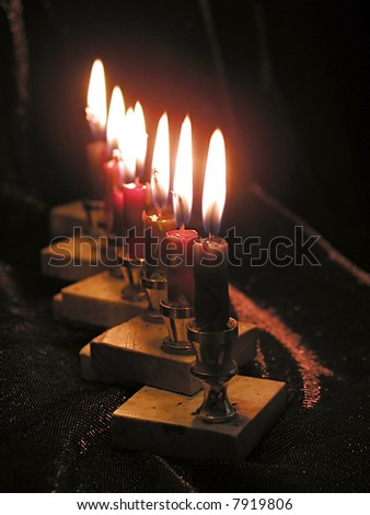Close up of eight Chanukkah candles.