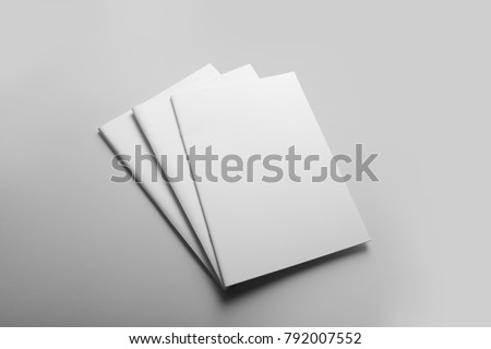 Real photo, brochure mockup template, softcover, collage, stack, isolated on light grey background to place your design.