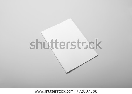 Real photo, brochure mockup template, softcover, isolated on light grey background to place your design.