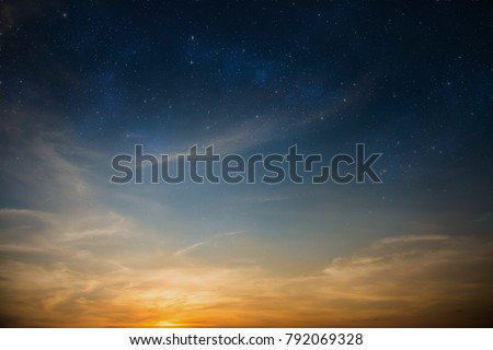 Dramatic sun-lit sky filled with stars as beautiful natural background