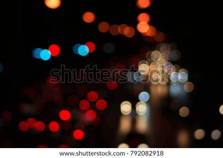 blurred- colorful Bokeh of traffic lights, From the car's illumination, In rush hour on the street in the city night.