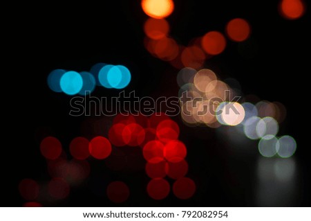 blurred- colorful Bokeh of traffic lights, From the car's illumination, In rush hour on the street in the city night.