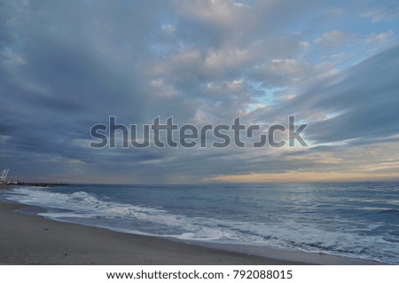  blue sea and sky with clouds at sunset