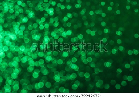 green abstract background with bokeh defocused lights christmas