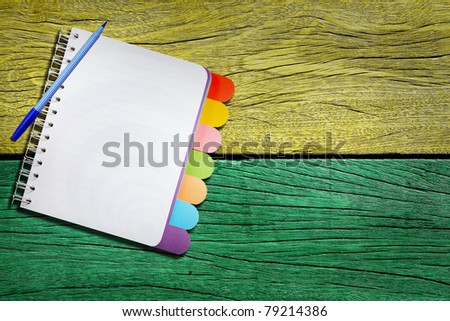 open note book on old wood background