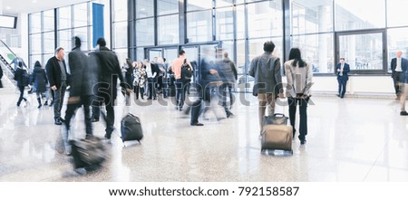 business commuters walking at a airport 