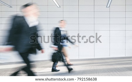 Blurred business people at corridor