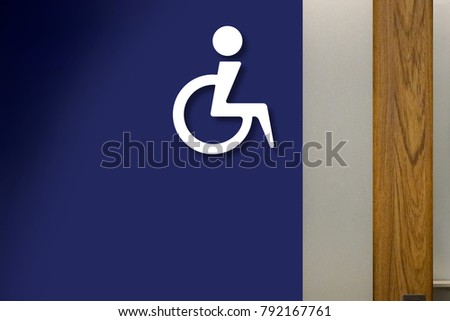 Handicap Disabled Sign on the Blue Wall