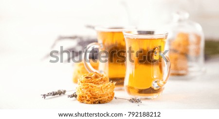 Lavender tea and Kadaif on a light background. Selective focus
