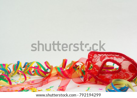 Carneval background with mask, confetti and garland