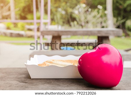 Picture blurred is valentine day,Red Heart,on wooden table.