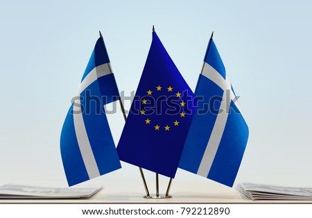 Two flags of Shetland and European Union flag between