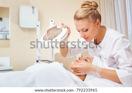Cosmetologist is a professional with a patient in the office of Royalty-Free Stock Photo #792233965