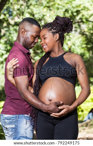 happy pregnant African-American couple